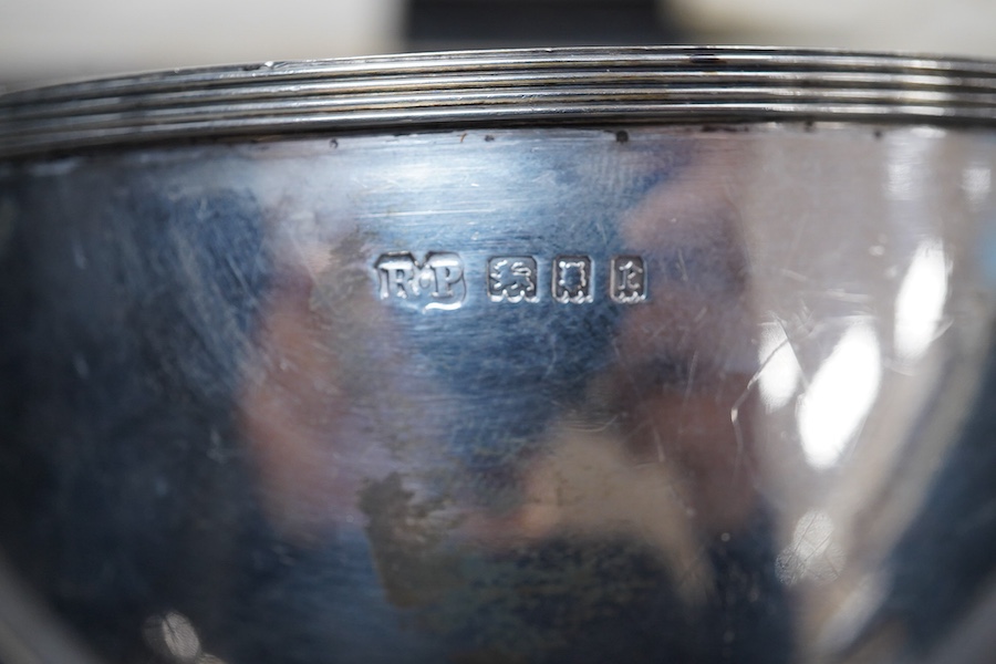A George V Britannia standard silver mug, by Thomas Bradbury & Sons, Sheffield 1918, height 65mm, handle a.f., together with a 1930's silver porringer and a George V cased silver christening bowl and spoon, 13.2OZ.